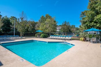 Sparkling swimming pool with expansive sundeck